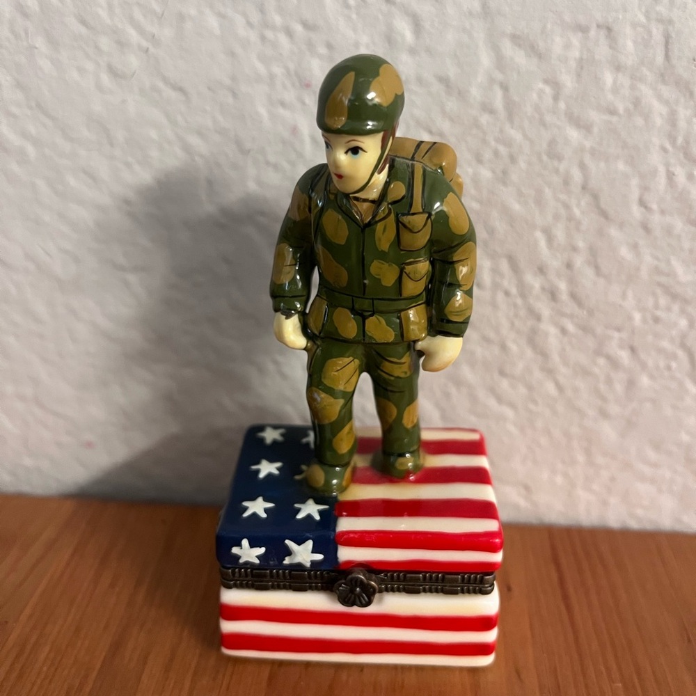 Camouflage Soldier Figurine on American Flag Box